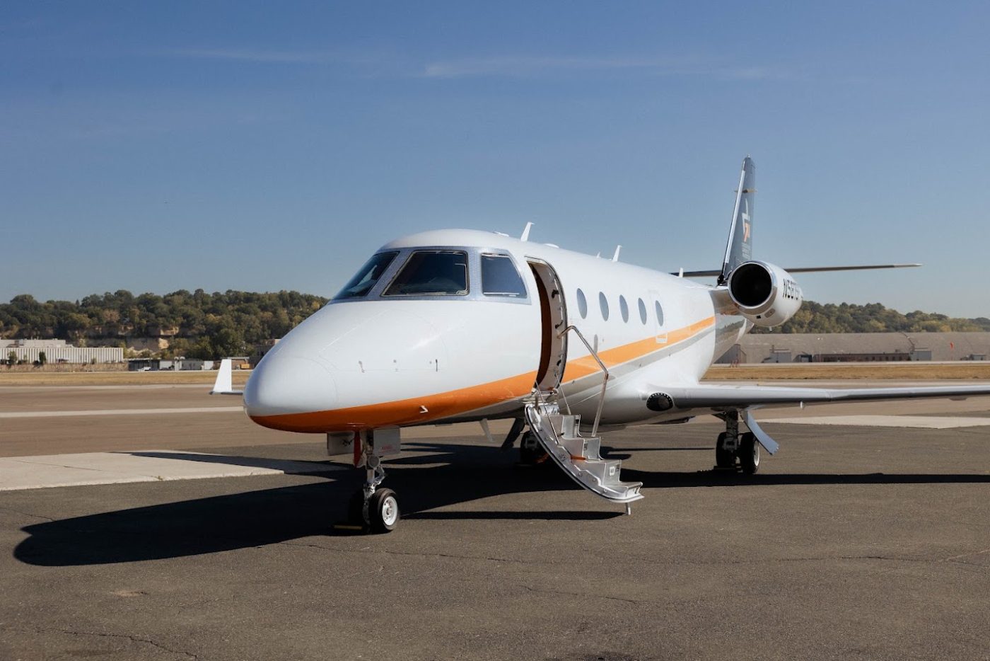 Business jet parked on the ramp with airstair deployed
