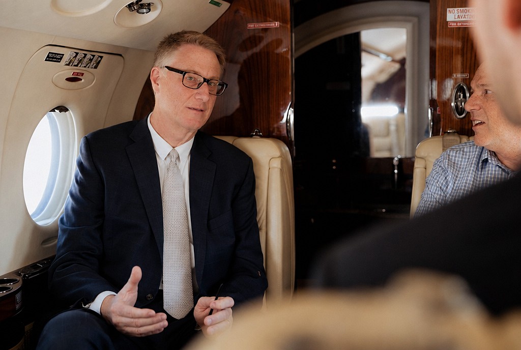 David Clark in conversation with a client in an aircraft cabin